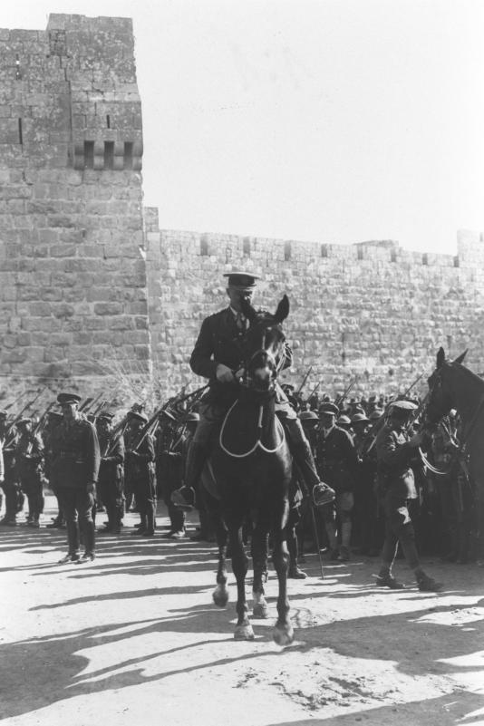 gen._edmund_hynman_allenby2c_the_commander_of_british_forces_in_palestine_during_world_war_i2c_riding_his_horse_alongside_the_walls_of_the_old_city_of_j
